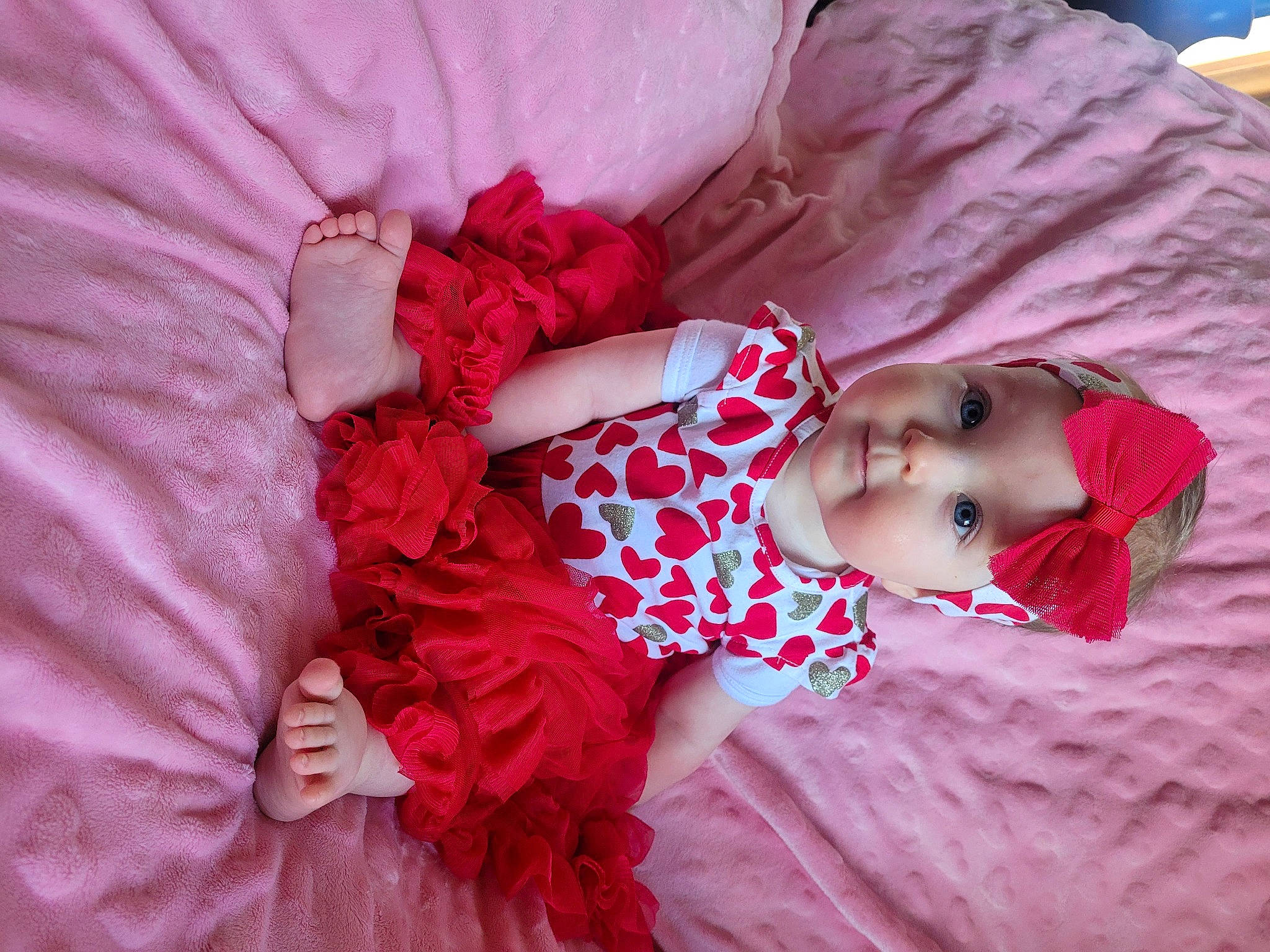 Kaylynn is registered to the contest to win money with this photo: baby, baby_toddler_clothing, beauty, comfort, dress, grass, happy, headwear, human_body, linens, lip, magenta, pattern, person, petal, pink, purple, skin, sleeve, textile