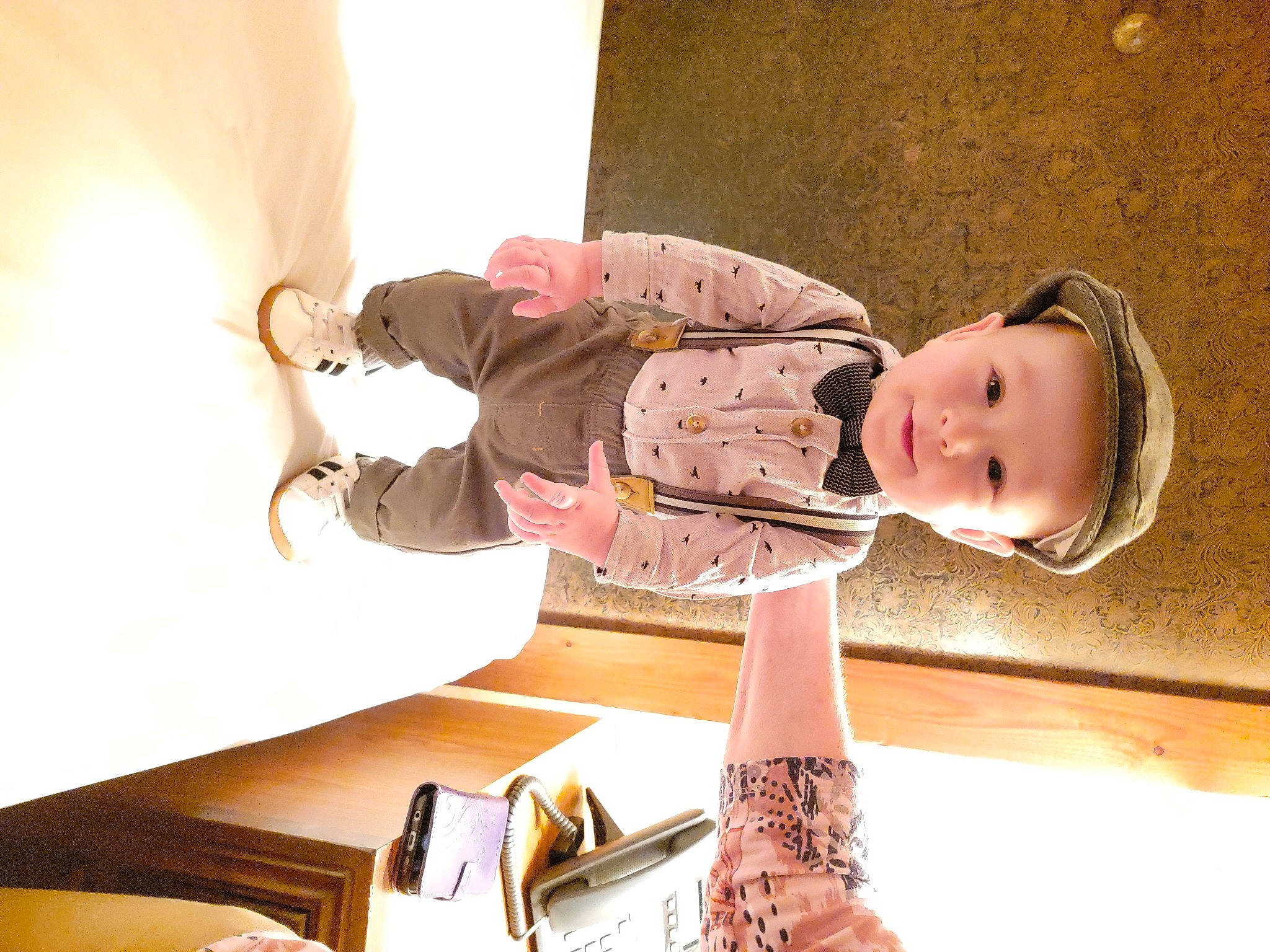 Jayden is registered to the contest to win money with this photo: baby, baby_toddler_clothing, child, comfort, dress, flooring, foot, fun, happy, headwear, human_body, human_leg, joint, knee, leg, person, room, shoe, sitting, thigh