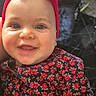 baby, child, smiling, face, headband, bow, red, floral_pattern, clothing, portrait, happy, cute, infant, indoors, person, skin, hand, bright_eyes, closeup, fashion