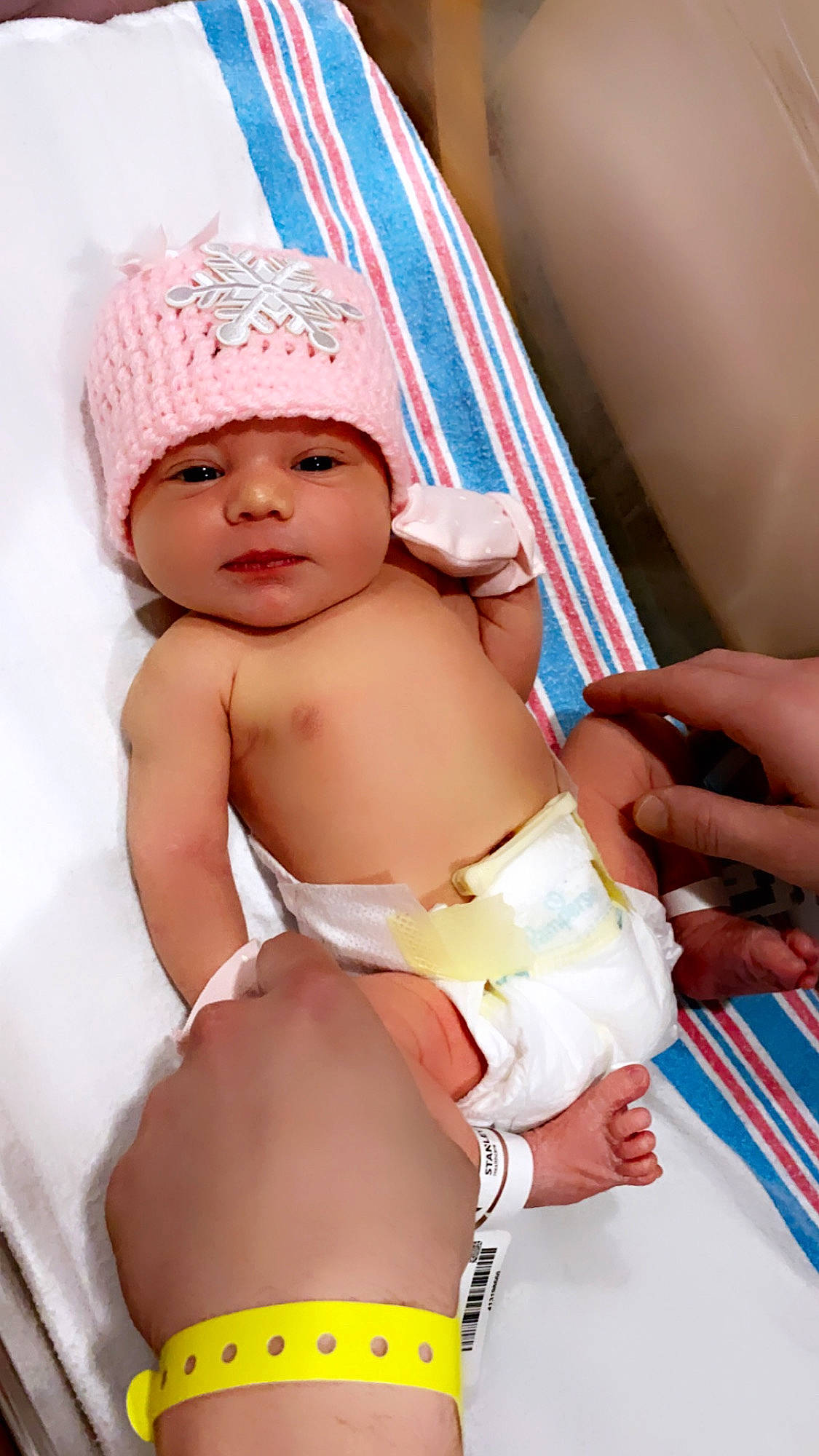 Capri is registered to the contest to win money with this photo: baby, baby_toddler_clothing, cap, chest, diaper, finger, happy, hat, headgear, headwear, human_leg, knee, navel, person, pink, skin, stomach, thigh, thumb, toddler