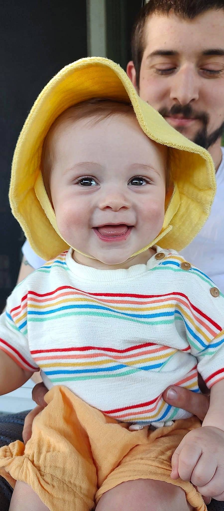Lucius is registered to the contest to win money with this photo: baby, baby_toddler_clothing, blue, cap, cheek, chin, face, facial_expression, happy, hat, iris, joy, lip, nose, organ, person, skin, sleeve, smile, toddler