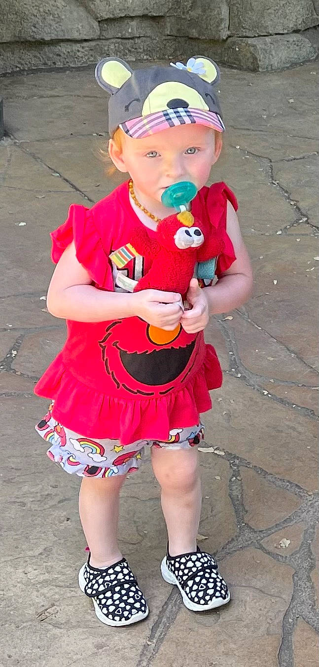 Emilia joined the competition — help win amazing prizes! baby, baby_toddler_clothing, dress, eye, face, fun, goggles, happy, hat, headwear, helmet, human_leg, magenta, person, personal_protective_equipment, pink, shoe, skin, sleeve, thigh