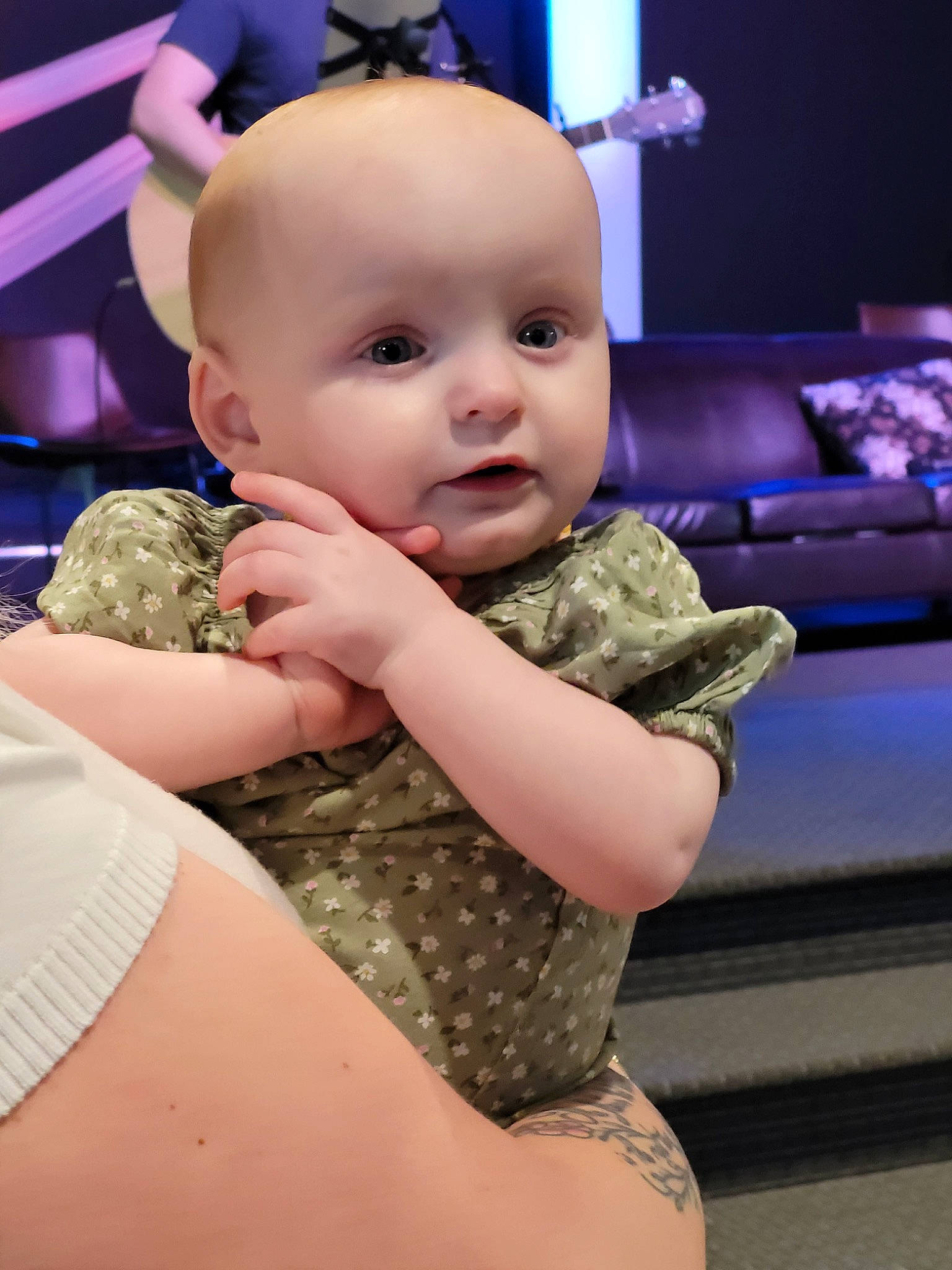 Emilia is registered to the contest to win money with this photo: baby, baby_toddler_clothing, cheek, child, comfort, couch, eye, flooring, fun, gesture, hand, happy, head, human_body, mouth, person, pink, skin, thigh, toddler