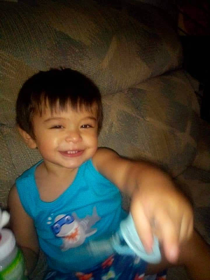 Edy is registered to the contest to win money with this photo: baby, baby_toddler_clothing, cheek, child, comfort, elbow, finger, fun, hand, happy, human_body, iris, joy, mouth, nose, person, plastic_bottle, skin, smile, thumb