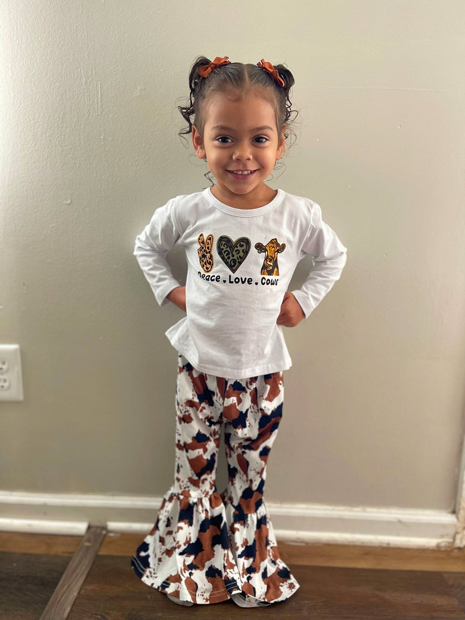 Elaina is registered to the contest to win money with this photo: active_pants, arm, baby_toddler_clothing, electric_blue, face, fashion_accessory, fashion_design, flooring, happy, head, joy, knee, neck, one_piece_garment, pattern, person, sleeve, smile, sportswear, t_shirt