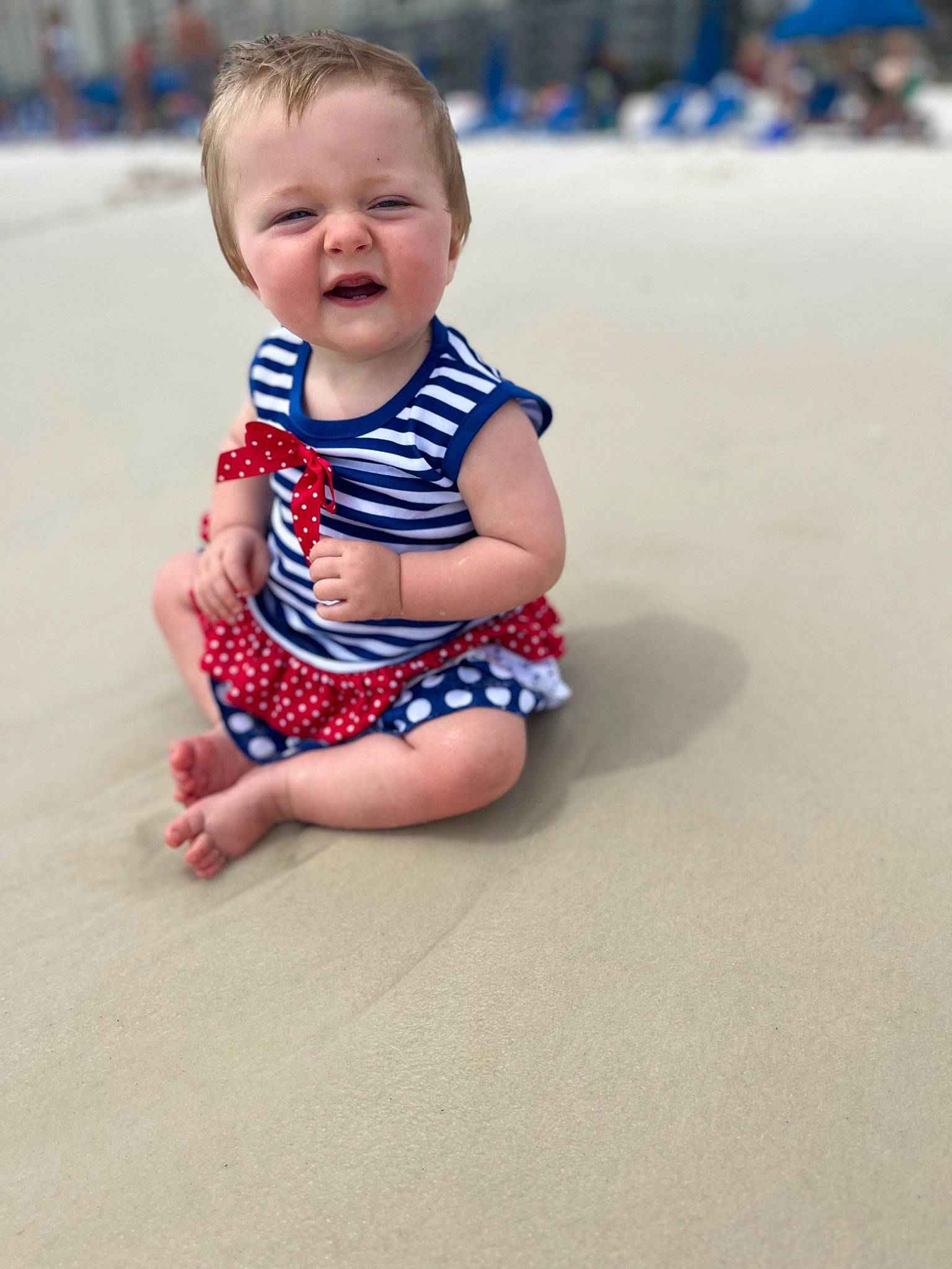 Savannah is registered to the contest to win money with this photo: baby, baby_toddler_clothing, barefoot, beach, child, electric_blue, eye, flooring, foot, fun, happy, head, human_body, human_leg, leisure, pattern, person, sand, skin, sleeve