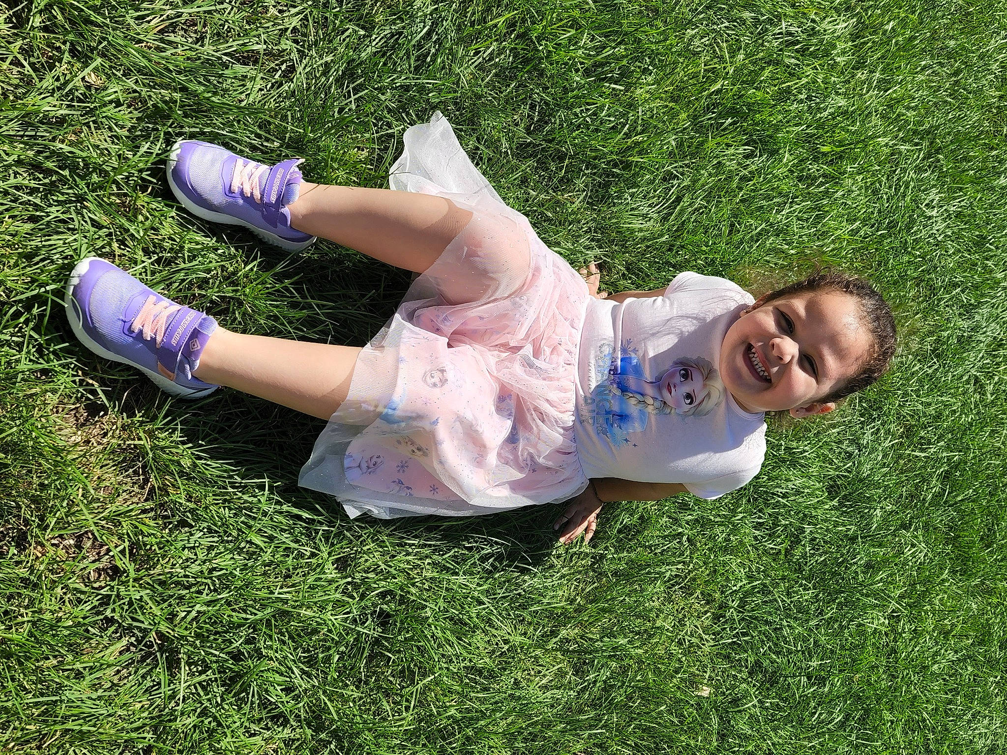 Stephanie is registered to the contest to win money with this photo: baby_toddler_clothing, barefoot, foot, fun, grass, grass_family, grassland, happy, human_leg, joy, knee, lawn, leg, leisure, people_in_nature, person, plant, recreation, sitting, smile