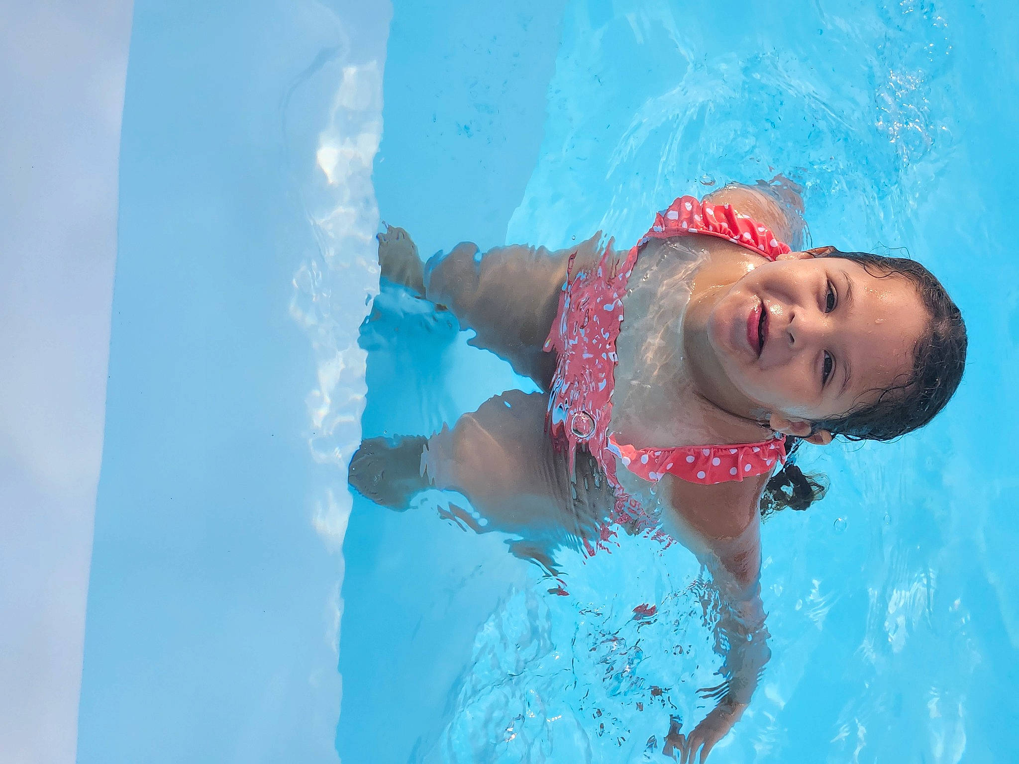 Stephanie is registered to the contest to win money with this photo: aqua, azure, bathing, blue, cap, elbow, electric_blue, fun, happy, headgear, leisure, leisure_centre, person, personal_protective_equipment, recreation, smile, swimmer, swimming_pool, swimwear, toddler