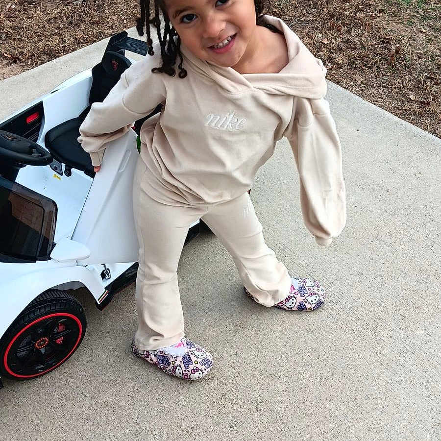 Zayleigh Campbell is registered to the contest to win money with this photo: alloywheel, car, carwheel, clothing, coat, face, footwear, head, jacket, machine, pants, person, photography, portrait, shoe, spoke, tire, transportation, vehicle, wheel