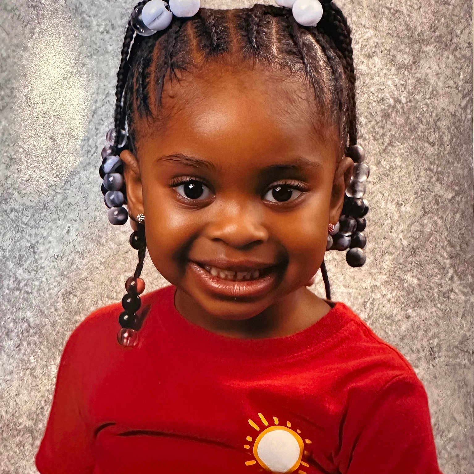 Soniyah is registered to the contest to win money with this photo: accessories, bodypart, child, clothing, earring, face, female, girl, hair, happy, head, jewelry, mouth, person, photography, portrait, shoulder, smile, t_shirt, teeth