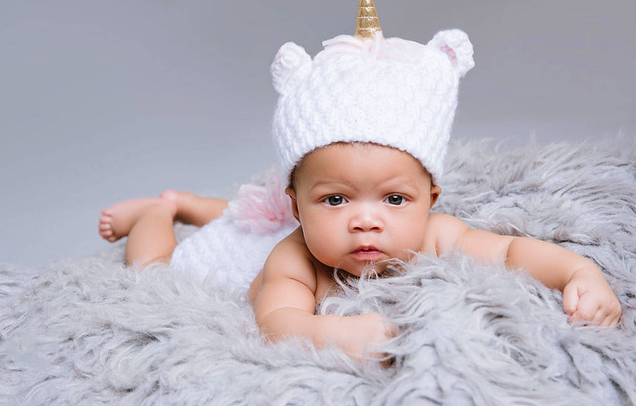 Harlee is registered to the contest to win money with this photo: baby, beanie, bonnet, cap, child, clothing, costume_accessory, crown, ear, fashion_accessory, fur, hat, head, headgear, headwear, knit_cap, person, photograph, photography, pink