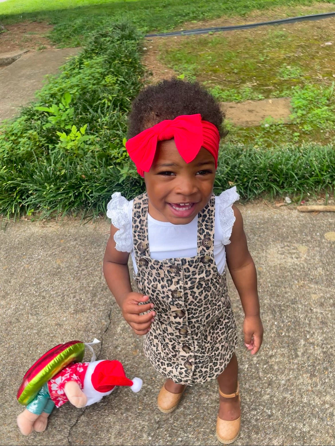 Londynn joined the competition — help win amazing prizes! adaptation, baby_toddler_clothing, cap, child, fashion_accessory, fun, grass, green, happy, headwear, joy, leisure, magenta, pattern, person, pink, plant, red, sandal, smile