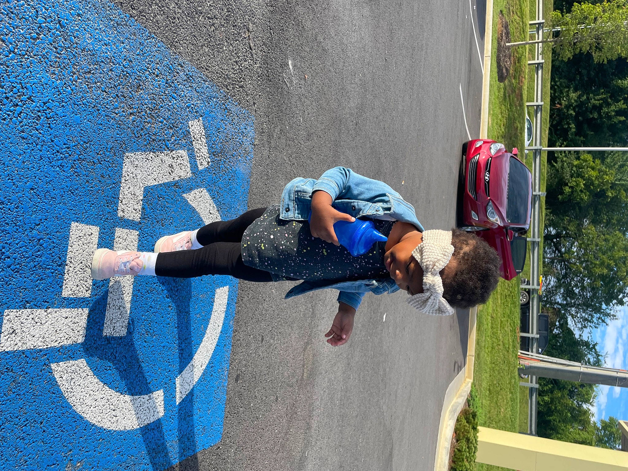 Londynn is registered to the contest to win money with this photo: adventure, asphalt, concrete, electric_blue, fun, helmet, leisure, pedestrian, person, recreation, road, road_surface, shadow, shorts, sidewalk, sky, sports, toddler, tree, walking_shoe