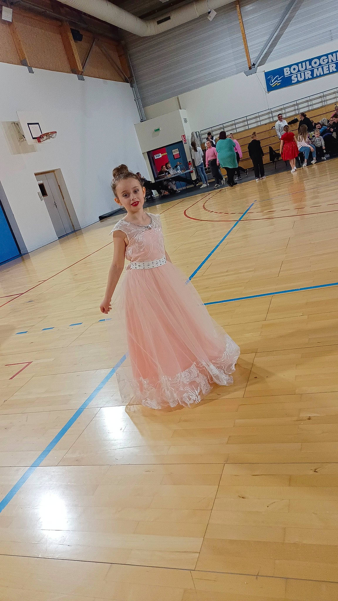 Zoe participe au concours pour gagner de l'argent avec cette photo : choreography, dancer, dress, entertainment, event, fashion_design, floor, flooring, formal_wear, fun, happy, hardwood, joy, leisure, one_piece_garment, performing_arts, person, recreation, smile, waist