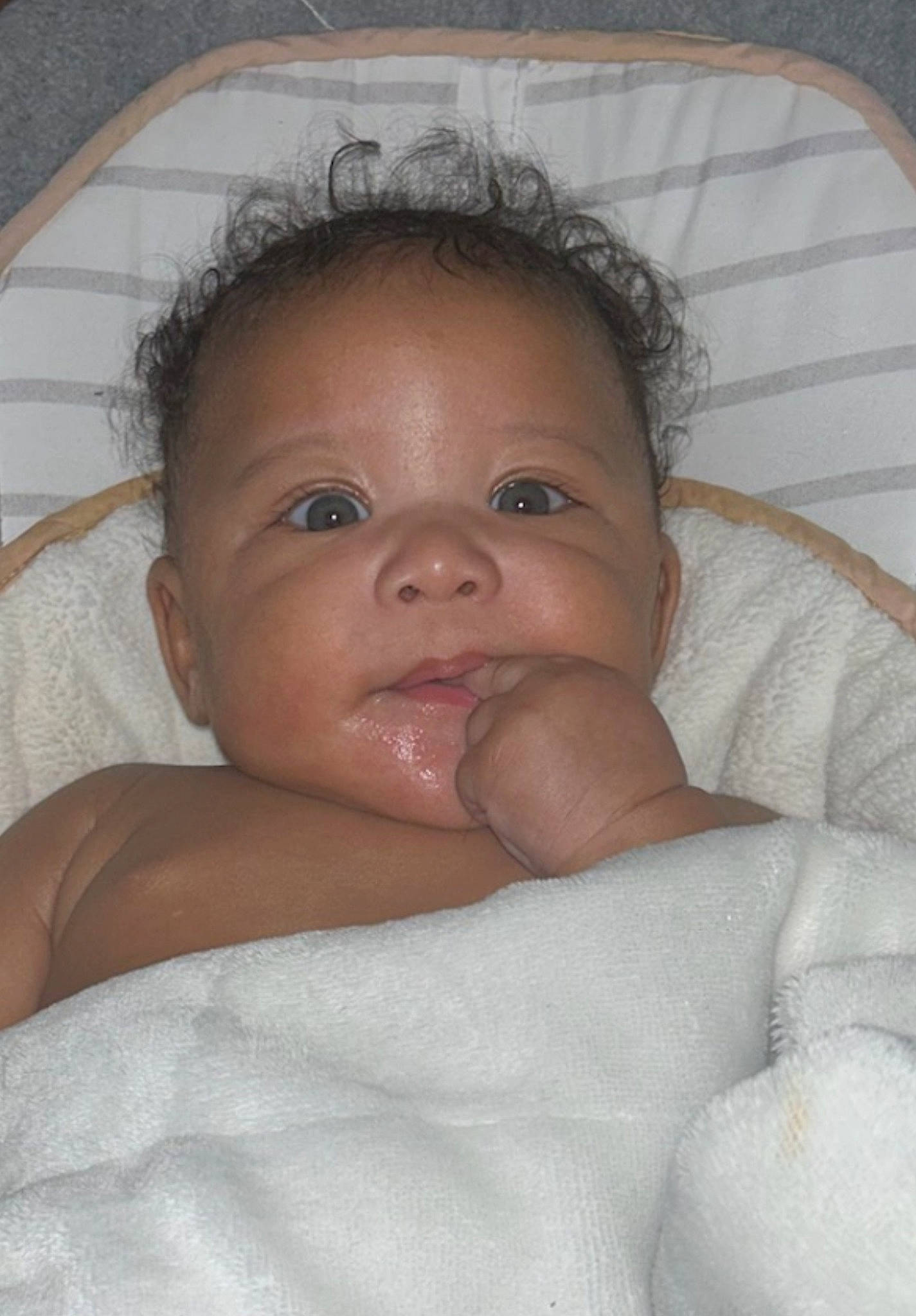 Ezra is registered to the contest to win money with this photo: baby, cheek, chin, comfort, ear, eye, eyebrow, eyelash, forehead, gesture, hair, hairstyle, head, iris, lip, mouth, neck, nose, person, skin