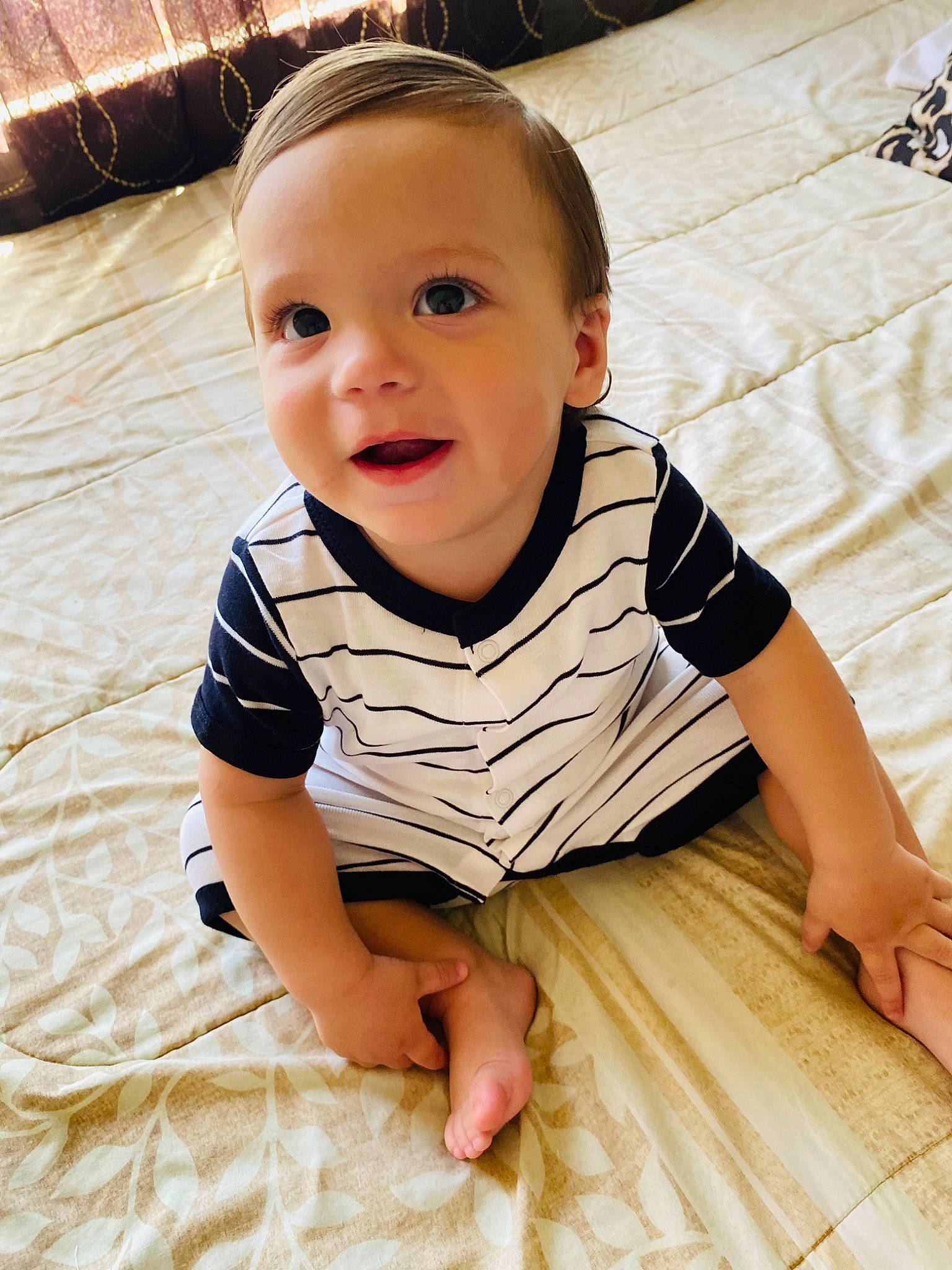 Amari is registered to the contest to win money with this photo: baby, baby_toddler_clothing, cheek, child, comfort, floor, flooring, fun, happy, hardwood, pattern, person, product, sitting, skin, sleeve, smile, t_shirt, toddler, vacation