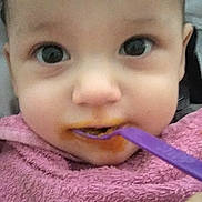 Matthew participe au concours pour gagner de l'argent avec cette photo : baby, bib, child, closeup, cute, expression, eyes, face, feeding, food, hand, indoor, infant, messy, mouth, person, pink, portrait, skin, spoon