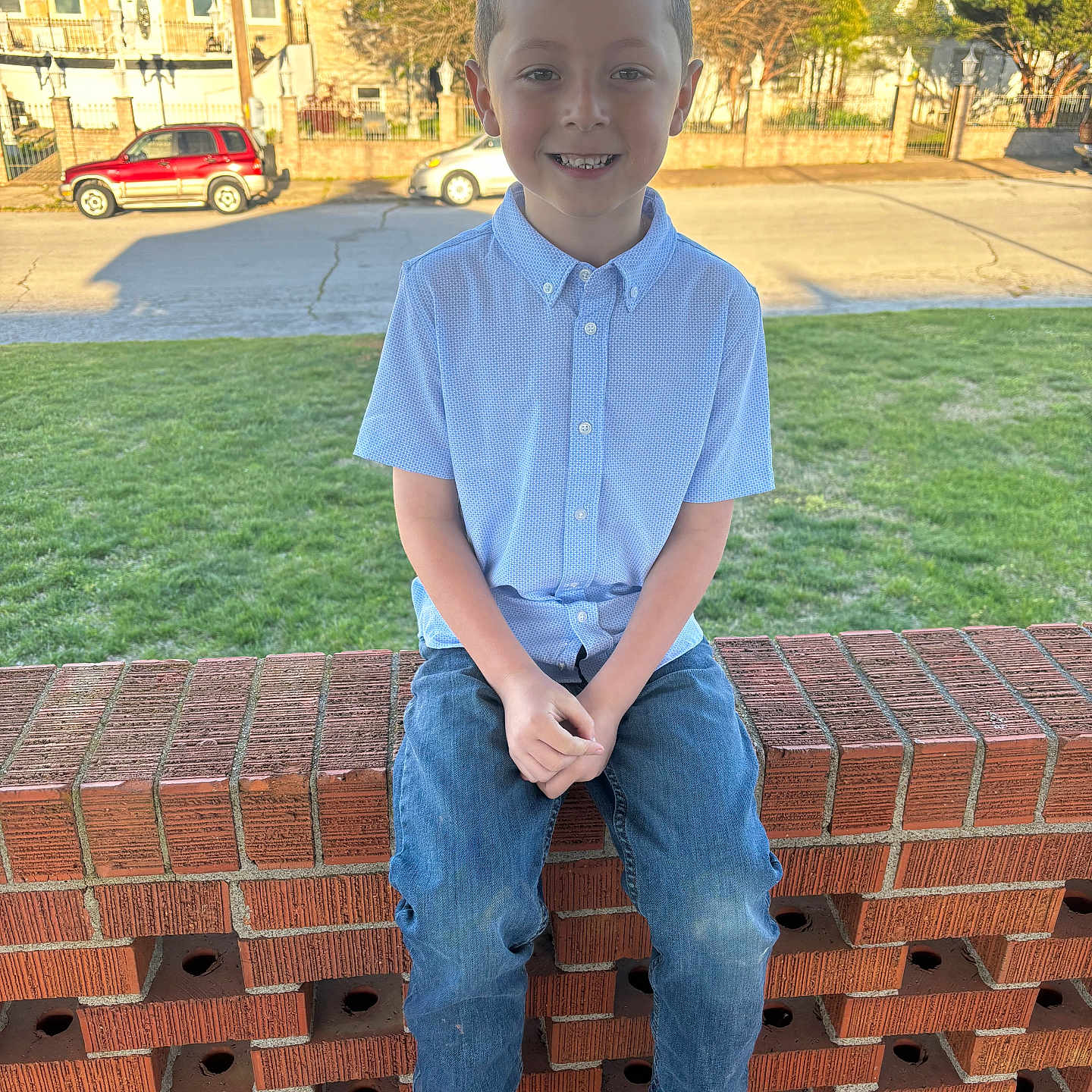 Gabriel Espino is registered to the contest to win money with this photo: boy, brick, car, child, clothing, face, grass, head, jeans, machine, male, pants, person, photography, plant, portrait, sitting, standing, transportation, vehicle