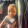 Elijah joined the competition — help win amazing prizes! baby, car, car_seat, child, closeup, clothing, curly_hair, cute, face, holding, indoors, infant, portrait, safety, seat, seatbelt, skin, straps, sunlight, young_child