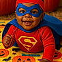 Elijah joined the competition — help win amazing prizes! baby, blue_mask, cape, child, costume, cute, festive, halloween, happy, holiday, indoor, infant, mask, mat, playful, portrait, pumpkin, red_clothing, smiling, superhero