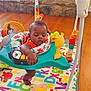 Elijah joined the competition — help win amazing prizes! activity_jumper, alphabet, baby, child, colorful, cute, fireplace, foot, furniture, hand, home, indoor, infant, orange_clothing, playmat, relaxed, sleeping, stone_wall, toy, wood_floor