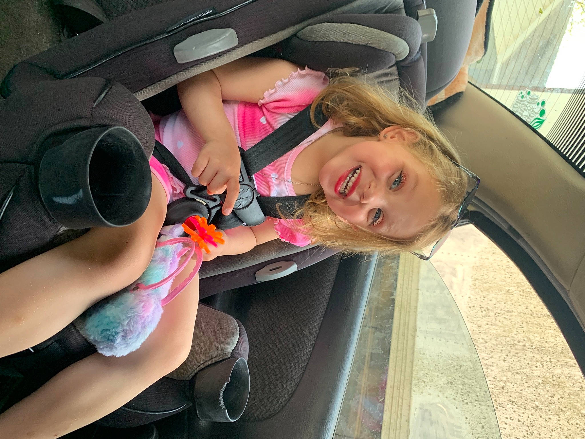 Aniyah is registered to the contest to win money with this photo: auto_part, automotive_design, automotive_exterior, automotive_lighting, automotive_tire, automotive_wheel_system, bumper, car, car_seat, car_seat_cover, hat, joy, motor_vehicle, mouth, person, personal_luxury_car, skin, smile, steering_wheel, travel