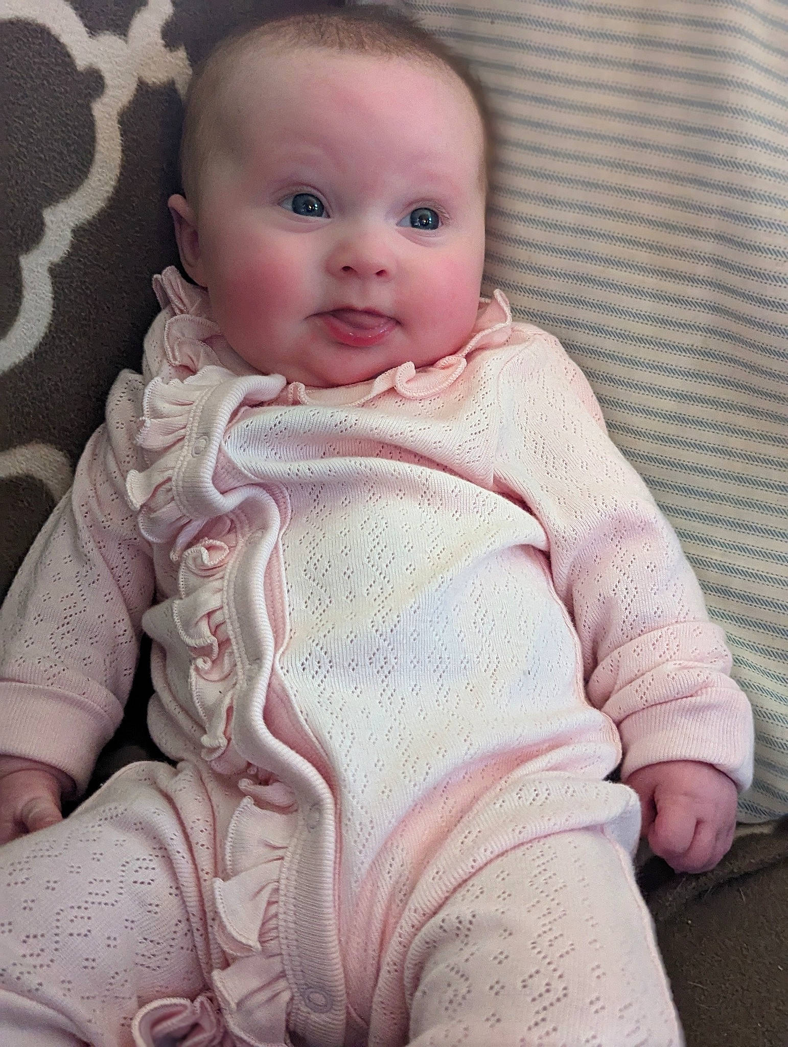 Kylee joined the competition — help win amazing prizes! baby, baby_toddler_clothing, cheek, collar, comfort, dress_shirt, eye, iris, linens, lip, nose, pattern, person, pink, sitting, skin, sleeve, smile, stomach, textile