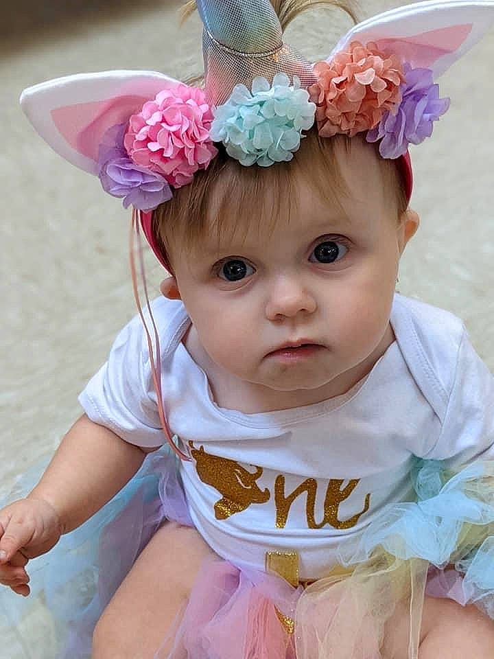 Aleia joined the competition — help win amazing prizes! baby, baby_toddler_clothing, blue, costume_hat, dress, eye, flower, happy, head, headband, headgear, headpiece, headwear, iris, person, petal, pink, plant, purple, sleeve