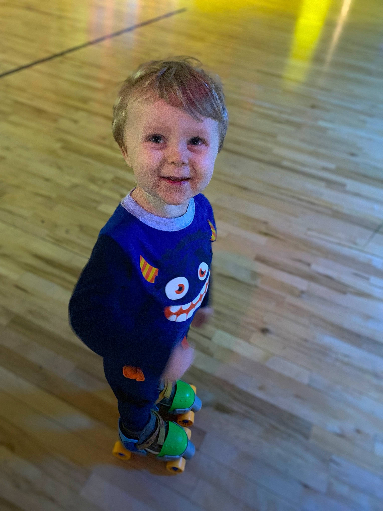 Kayne is registered to the contest to win money with this photo: baby, blue, child, electric_blue, eye, floor, footwear, fun, happy, joy, outerwear, person, play, skin, smile, standing, t_shirt, toddler, vacation, yellow