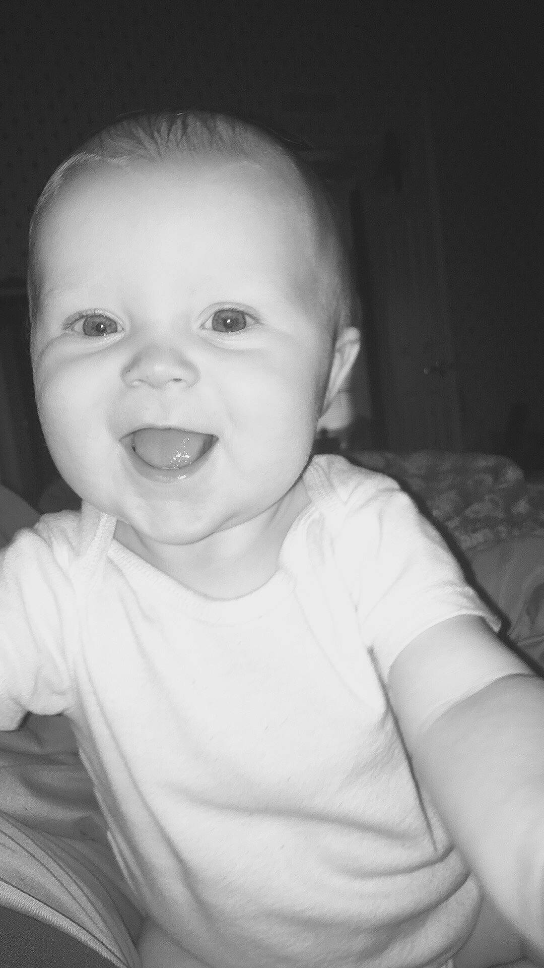 Kayne joined the competition — help win amazing prizes! baby, black, black_and_white, cheek, child, chin, eye, face, facial_expression, head, lip, monochrome, nose, people, person, photograph, skin, smile, standing, toddler