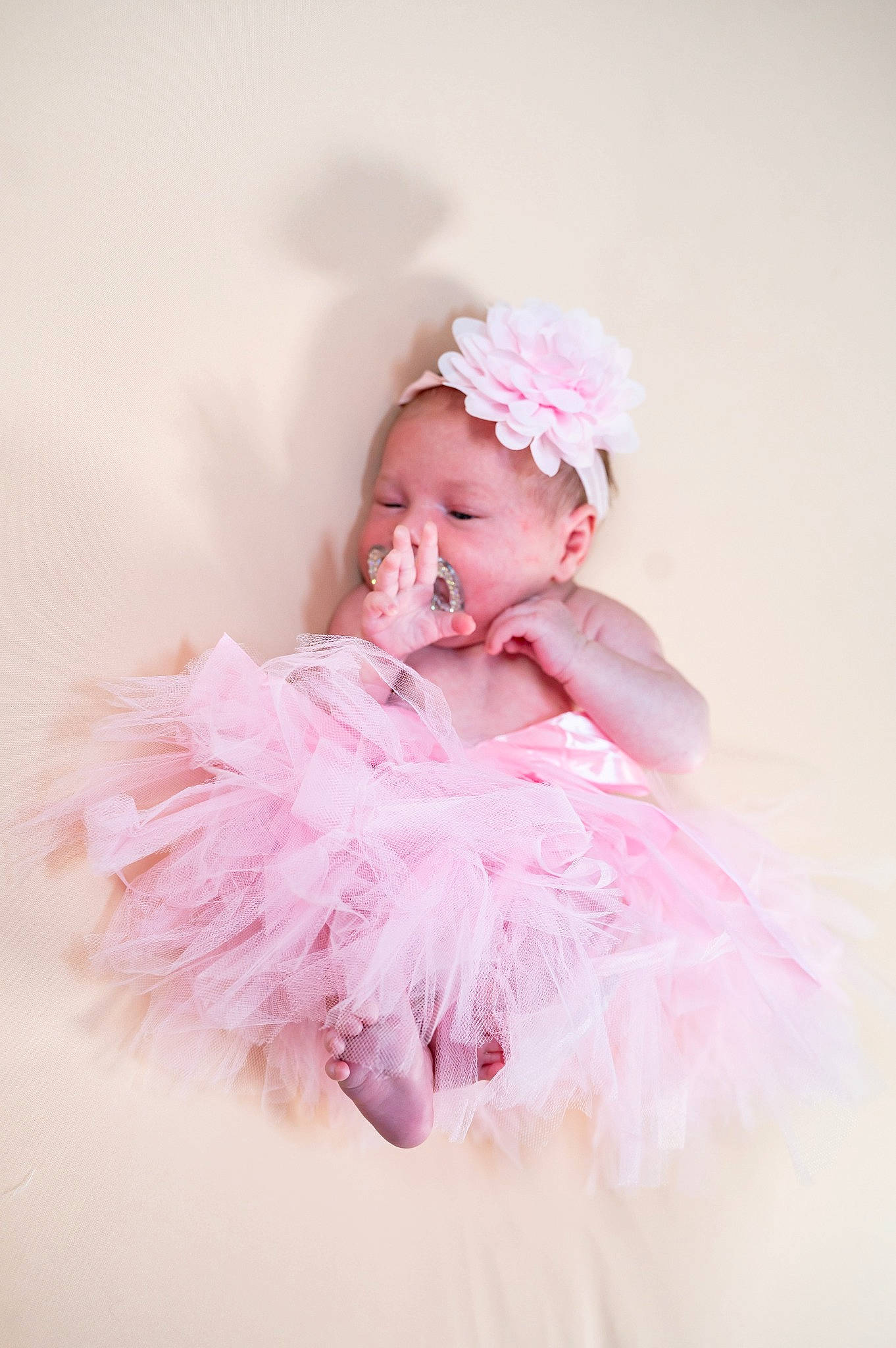 Ranya Georgiana is registered to the contest to win money with this photo: baby, baby_toddler_clothing, bridal_accessory, dress, embellishment, event, fashion_accessory, fashion_design, flash_photography, hair_accessory, happy, headband, headpiece, magenta, peach, person, petal, pink, ruffle, smile