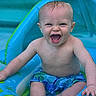 baby, blue, child, cute, expression, fun, happy, infant, inflatable, outdoor, playful, pool, sitting, skin, splash, summer, swimwear, toy, water, wet