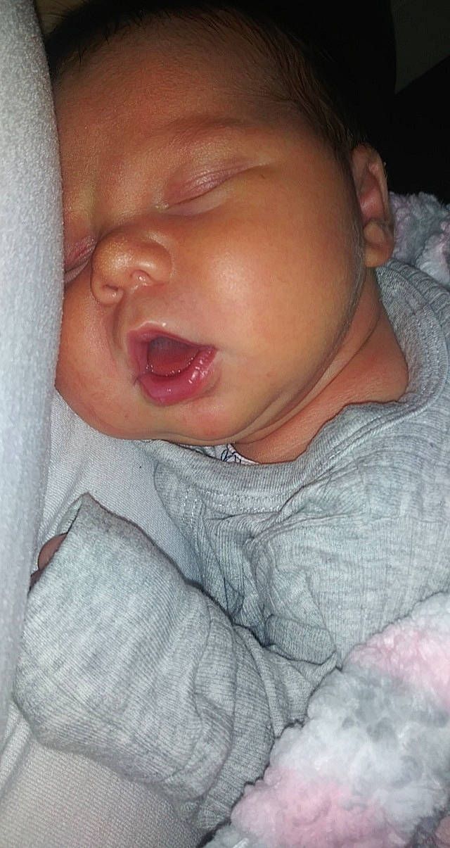 Jemma is registered to the contest to win money with this photo: baby, baby_toddler_clothing, cheek, comfort, ear, eyebrow, eyelash, forehead, gesture, happy, iris, jaw, lip, mouth, neck, nose, person, skin, sleeve, smile