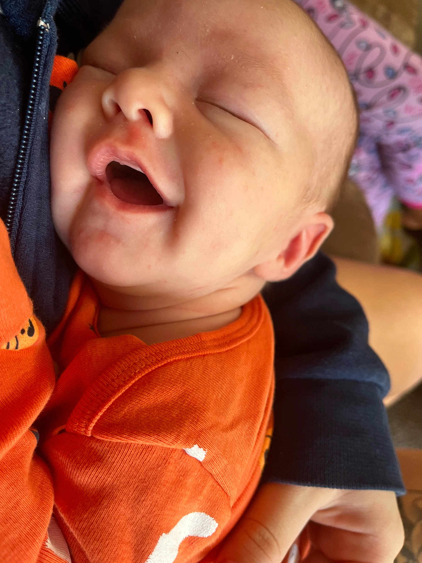 Oliver joined the competition — help win amazing prizes! baby, infant, smiling, face, skin, orange_clothing, child, person, closeup, sleeping, hand, arm, texture, fabric, comfort, peaceful, cute, young, portrait, toddler