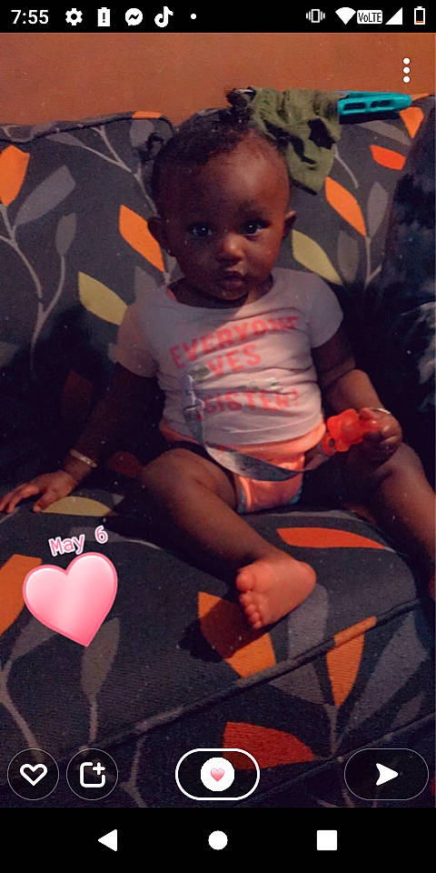 Jayla is registered to the contest to win money with this photo: baby, baby_carriage, baby_toddler_clothing, chair, child, cool, fun, happy, human_leg, lap, magenta, mouth, person, pink, room, shorts, sitting, t_shirt, textile, thigh