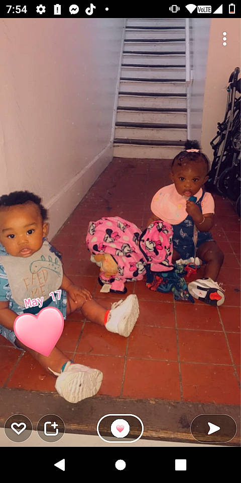 Jaylin is registered to the contest to win money with this photo: baby, baby_toddler_clothing, cheek, child, comfort, facial_expression, floor, flooring, fun, hairstyle, head, houseplant, joint, mouth, person, pink, red, sitting, skin, sock