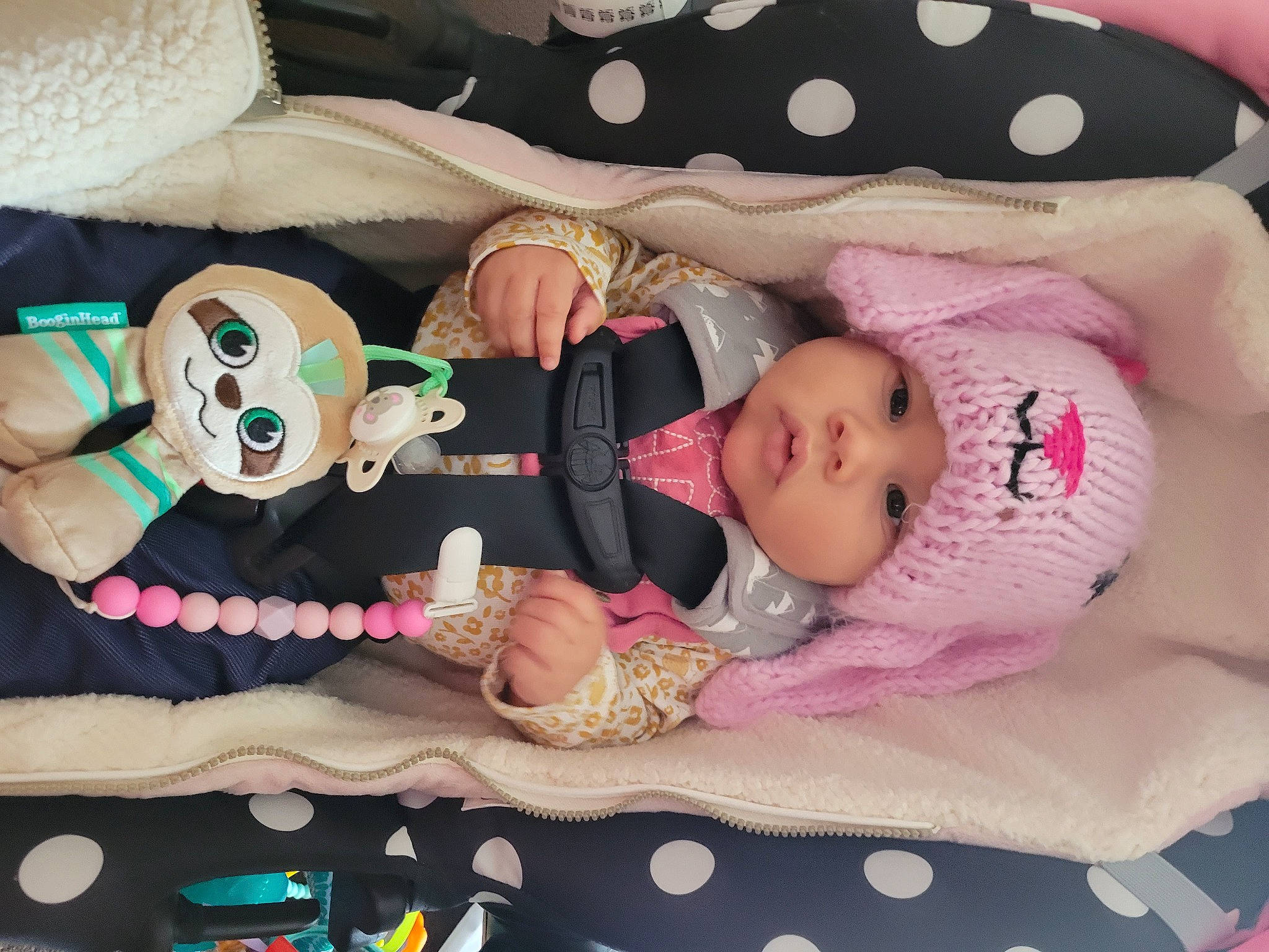 Gabriela is registered to the contest to win money with this photo: baby, baby_products, baby_toddler_clothing, baby_toys, cheek, child, comfort, face, head, headwear, linens, pattern, person, pink, product, room, textile, toddler, toy, white