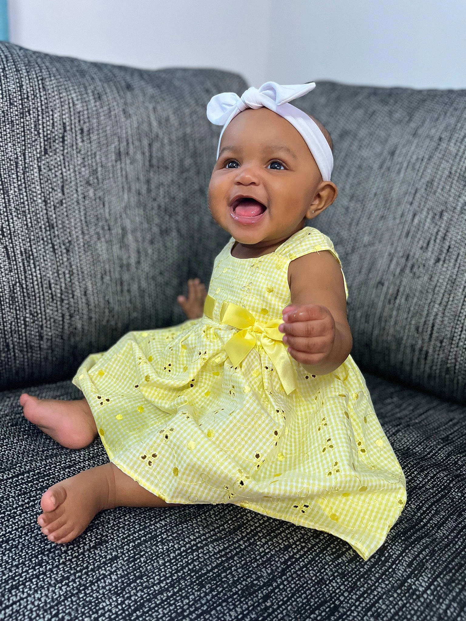 Zyaira is registered to the contest to win money with this photo: baby, baby_toddler_clothing, cap, cheek, child, comfort, costume_hat, couch, eye, face, fashion_accessory, happy, head, headgear, headwear, person, sitting, sleeve, smile, textile