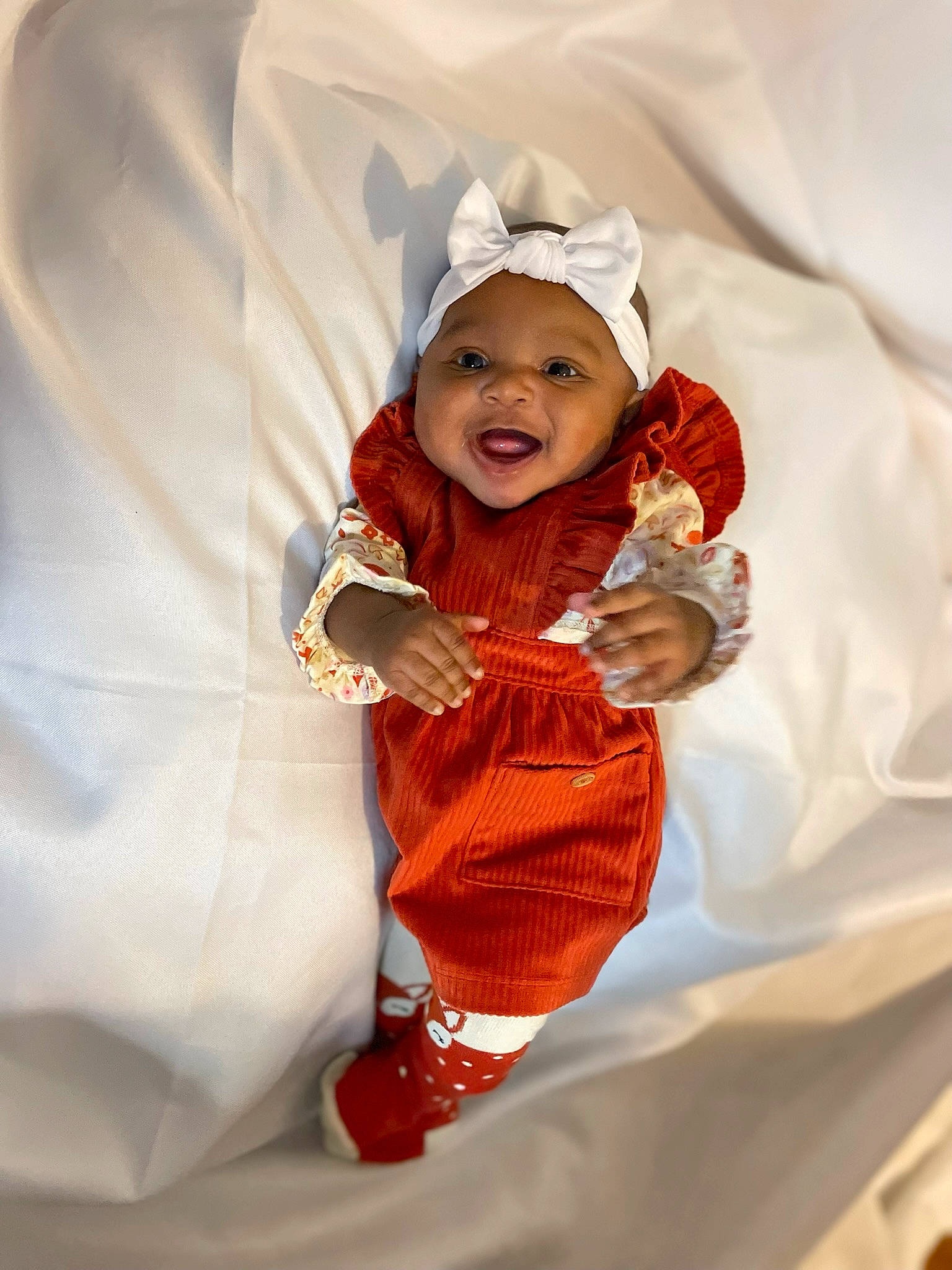Zyaira joined the competition — help win amazing prizes! baby, baby_toddler_clothing, child, comfort, dress, event, finger, fun, gesture, happy, headwear, laugh, linens, peach, person, petal, skin, sleeve, smile, textile