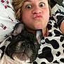 Hunter joined the competition — help win amazing prizes! person, dog, selfie, face, black_and_white, bed, pillow, pattern, cow_print, cute, pet, animal, indoor, funny_face, closeup, cuddle, expression, young_adult, casual, resting