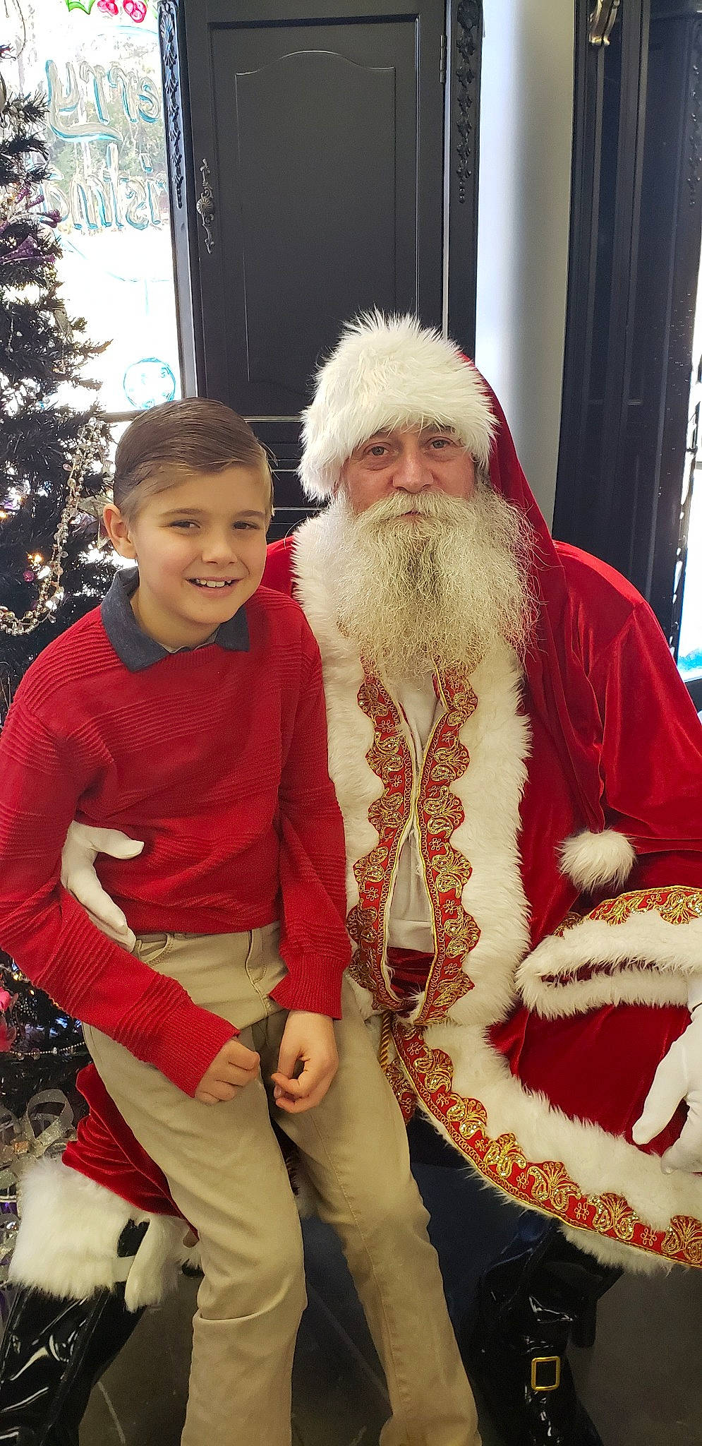 Tucker joined the competition — help win amazing prizes! beard, christmas, costume, event, facial_hair, fictional_character, fun, headwear, holiday, joy, lap, person, product, santa_claus, tradition