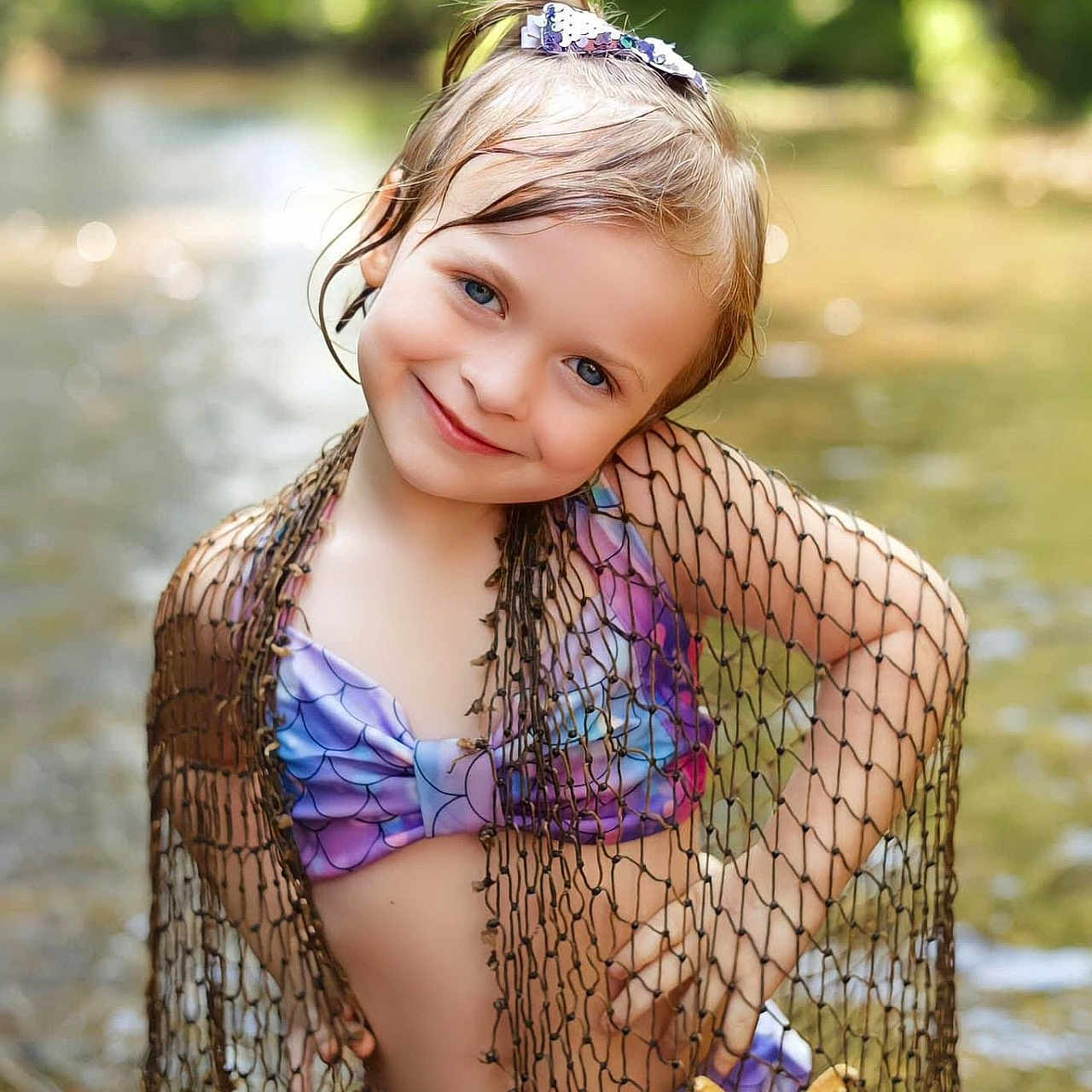 Journee is registered to the contest to win money with this photo: accessories, child, clothing, dress, earring, face, female, girl, happy, head, jewelry, person, photography, plant, portrait, smile, summer, swimwear, tree, vegetation