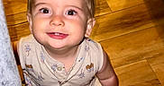 Ronin joined the competition — help win amazing prizes! baby, child, smiling, mohawk, sitting, wooden_floor, indoors, cute, happy, face, person, clothing, couch, eyes, skin, hair, expression, infant, one_person, portrait