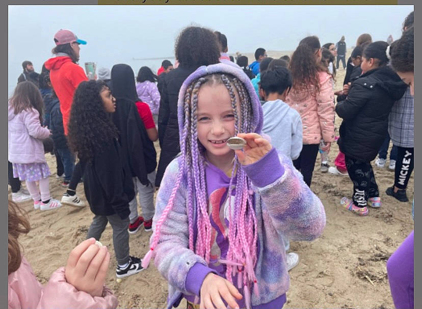 Aleigha is registered to the contest to win money with this photo: child, crowd, event, fun, happy, hat, jewellery, landscape, leisure, magenta, natural_environment, person, pink, purple, recreation, sand, smile, soil, tourism, tradition