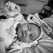 Nora joined the competition — help win amazing prizes! baby, newborn, sleeping, blanket, headband, bow, infant, closeup, soft, cozy, cute, peaceful, portrait, indoors, rest, toddler, face, child, wrapped, sleep