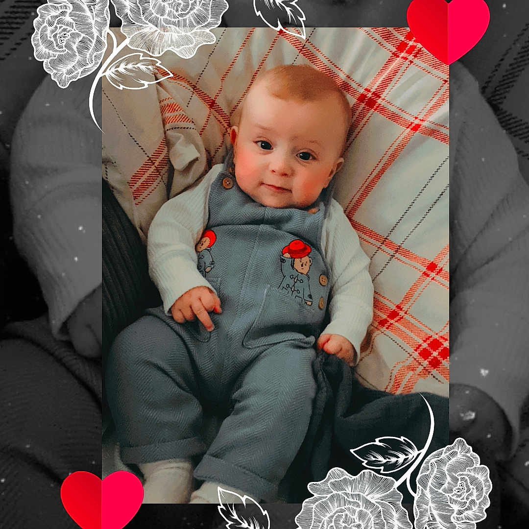 Gabriel-Edward joined the competition — help win amazing prizes! artistic_overlay, baby, child, cozy, cushion, cute, decorative_flowers, face, indoor, infant, love, overalls, patterned_background, plaid, portrait, red_hearts, sitting, smiling, soft_lighting, white_sweater