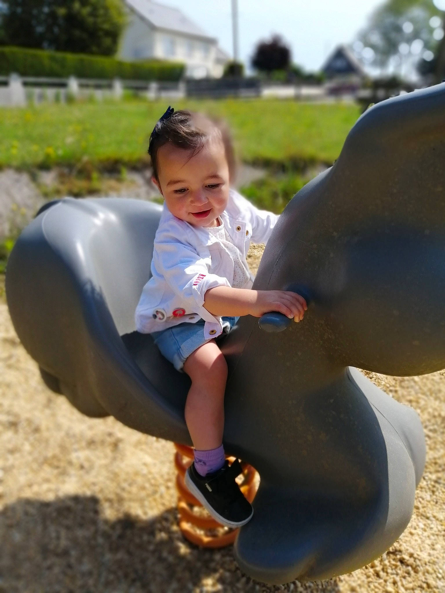 Djena a rejoint le concours — aidez-le/la à gagner de superbes lots ! baby, child, fun, happy, horse, joy, leisure, outdoor_play_equipment, person, play, playground, public_space, recreation, sitting, smile, summer, toddler, vacation