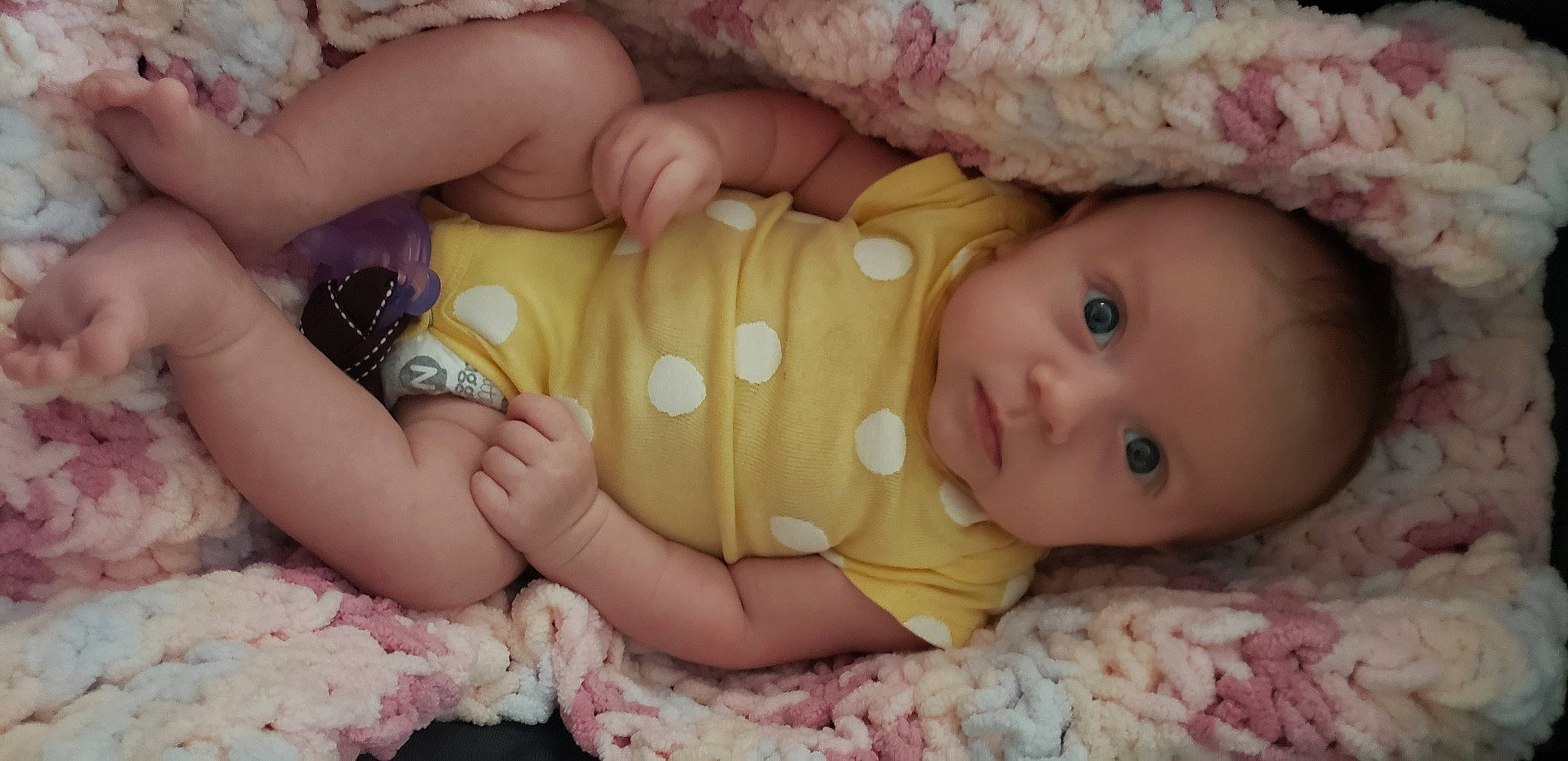 Antonina is registered to the contest to win money with this photo: arm, baby, baby_toddler_clothing, cheek, dress, eye, face, facial_expression, finger, hand, head, human_body, iris, lip, nail, nose, person, pink, skin, sleeve