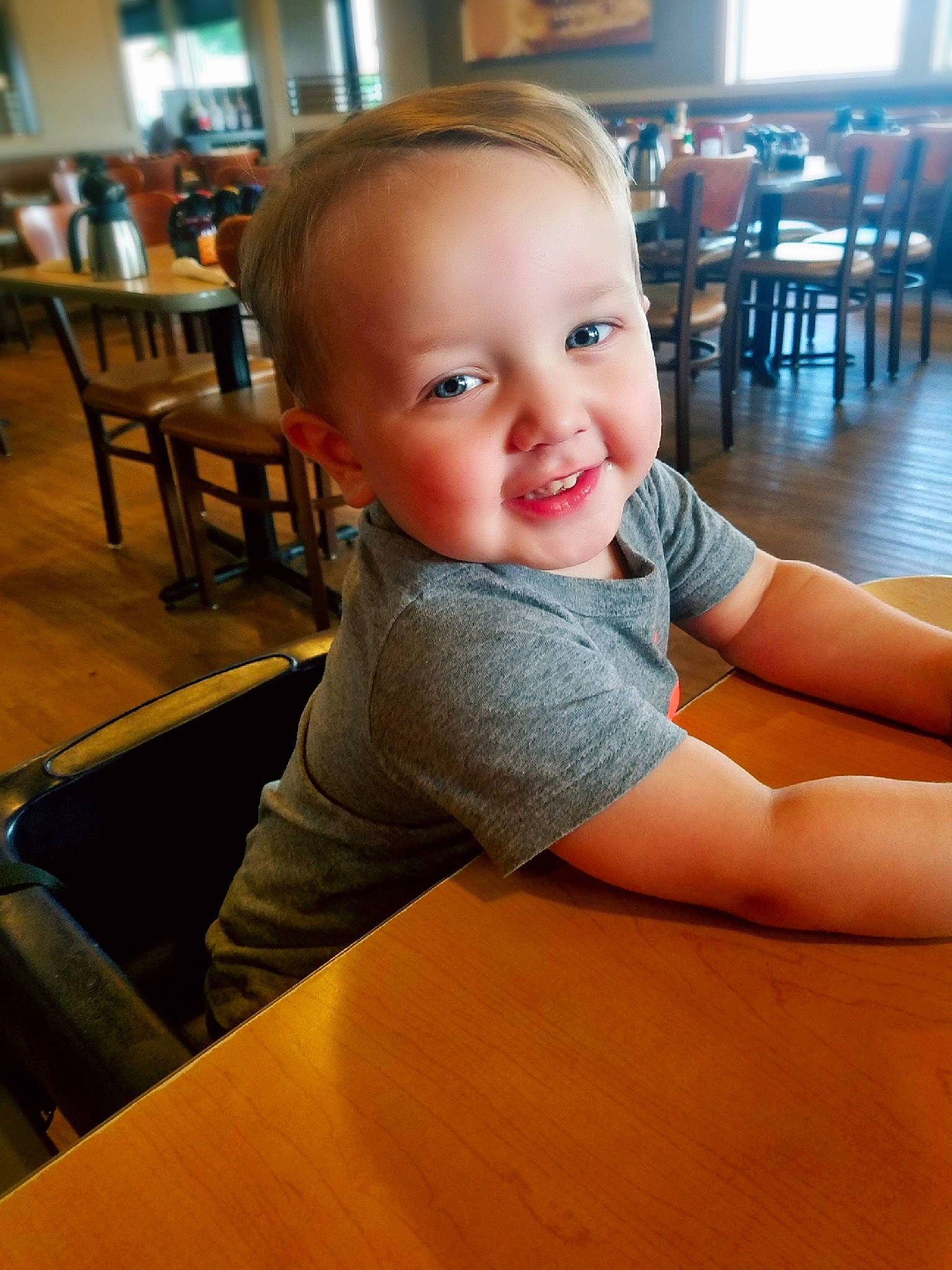 Titan is registered to the contest to win money with this photo: boy, cheek, child, day, eye, flooring, fun, girl, hand, human_hair_color, infant, leg, person, sitting, skin, smile, standing, toddler