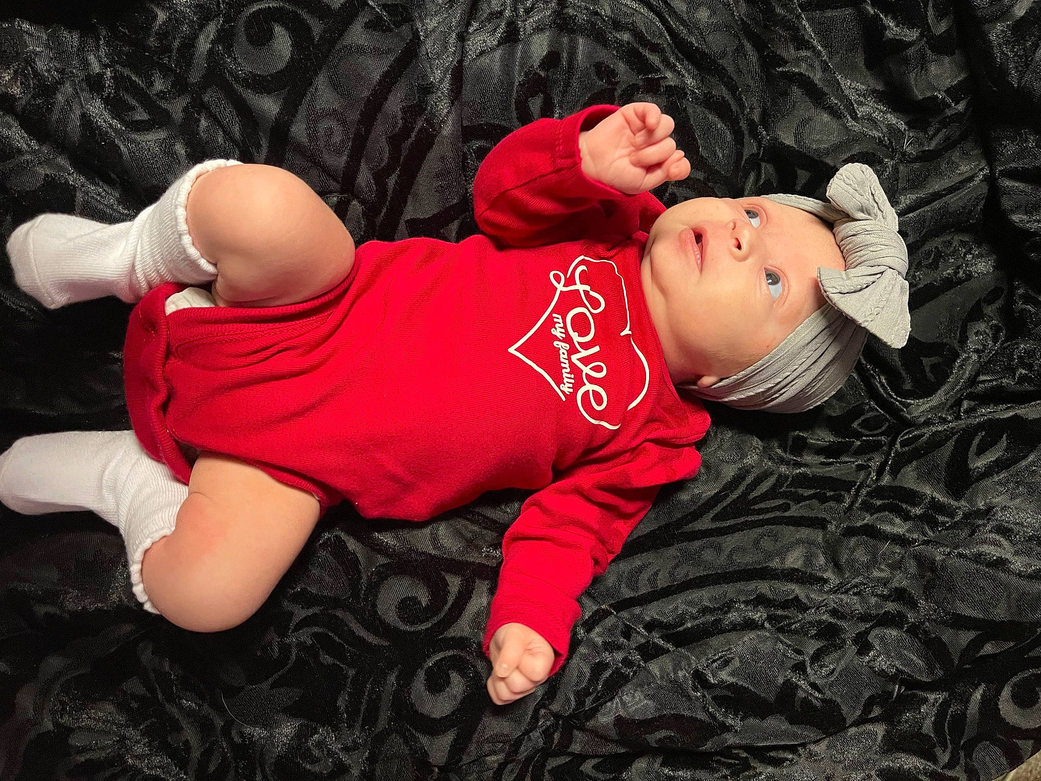 Cattleya is registered to the contest to win money with this photo: baby, baby_toddler_clothing, carmine, child, comfort, flash_photography, grass, happy, headwear, human_leg, linens, magenta, nap, pattern, person, portrait_photography, sitting, sleeve, t_shirt, toddler